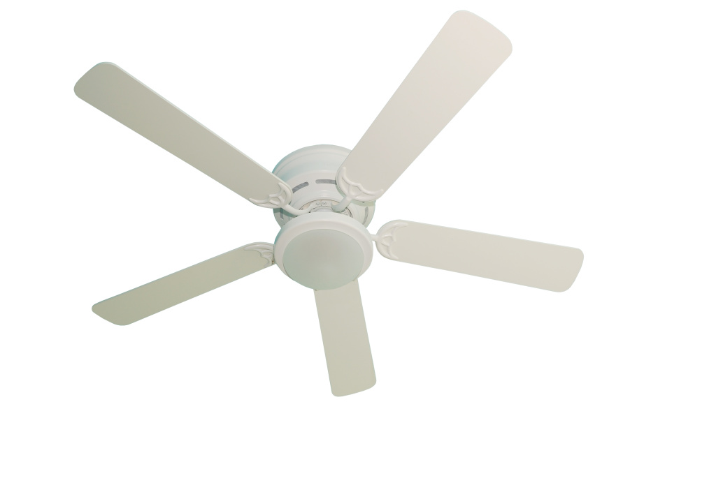 A white ceiling fan on a white background.