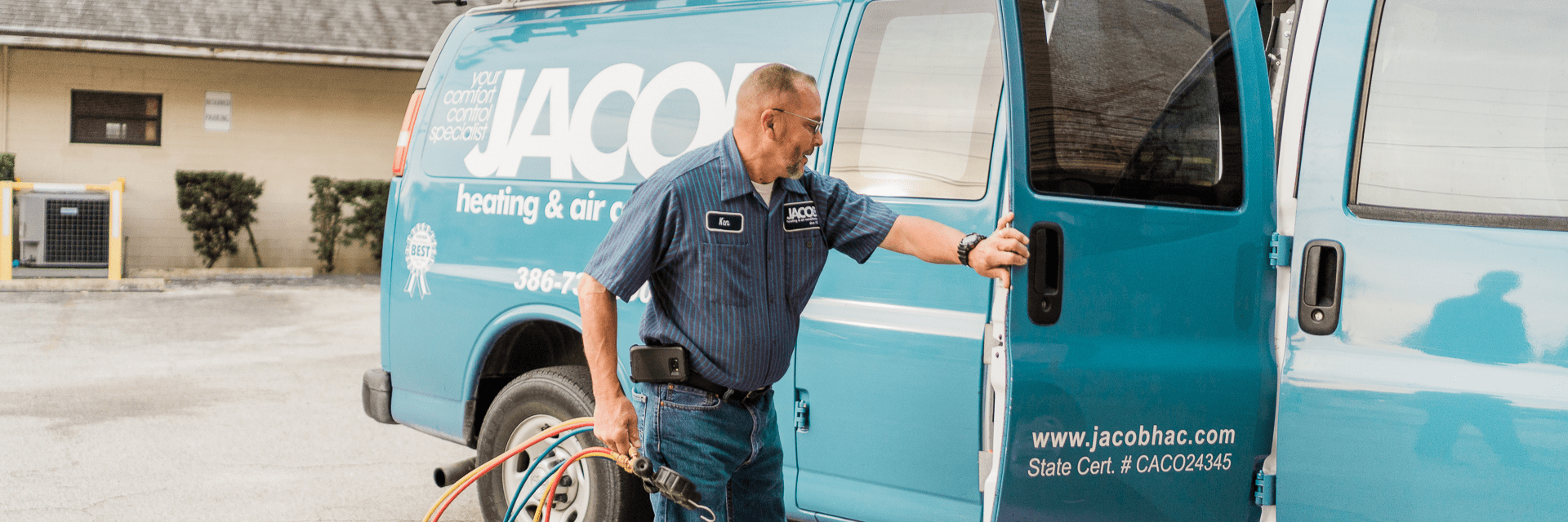 A Jacob employee gathers his tools from his van. 