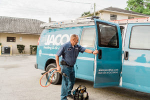 Jacob Heating & Air employee loading hvac equipment into truck