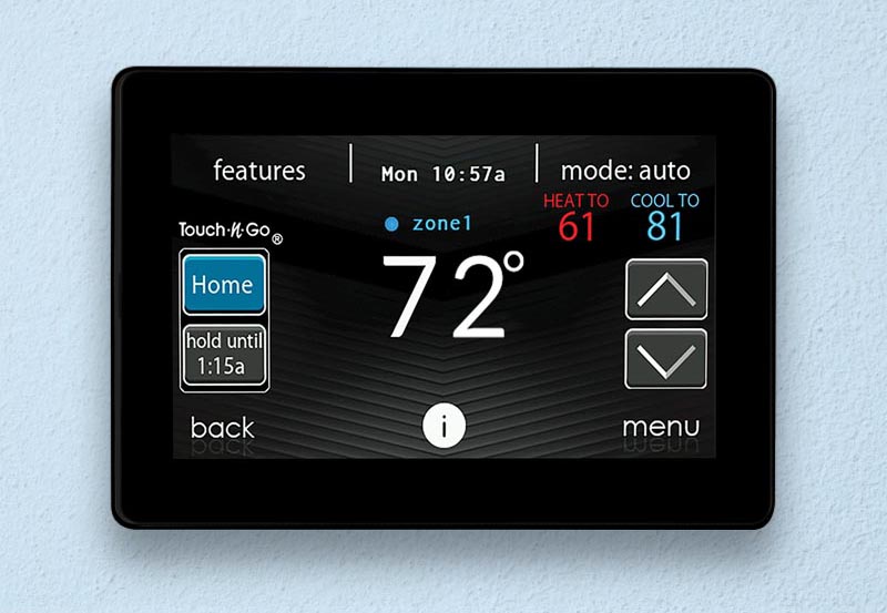 Digital screen of a black smart thermostat highlighting the indoor temperature is at 72 degrees.